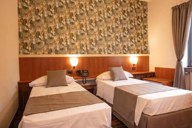 Twin room with decorative wall